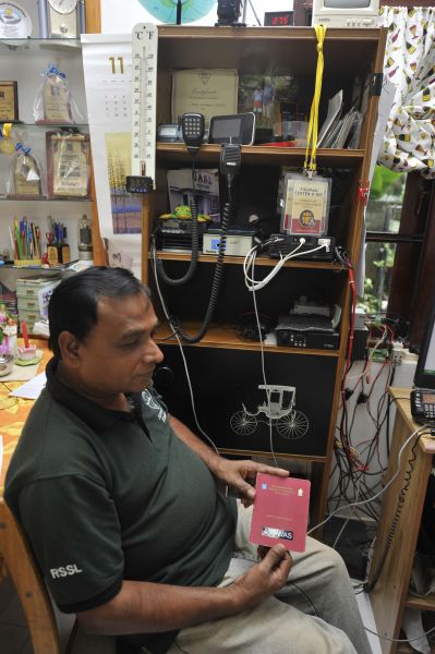Sri Lanka 4S6WAS Senarath, 4S6WAS, shows his Amateur Radio Licence. 